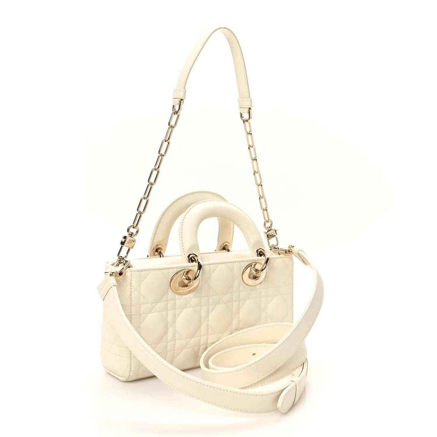 Small white quilted handbag with chain strap, top handles, and circular accent