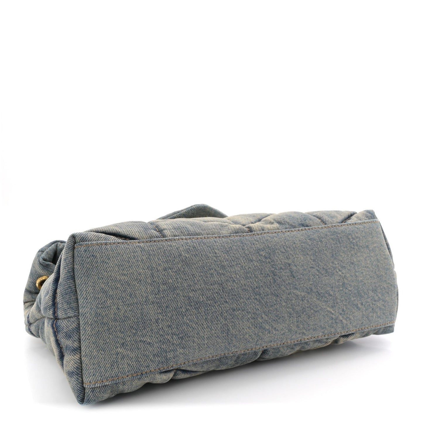 Denim quilted puffer satchel with folded top edge and tan leather base trim