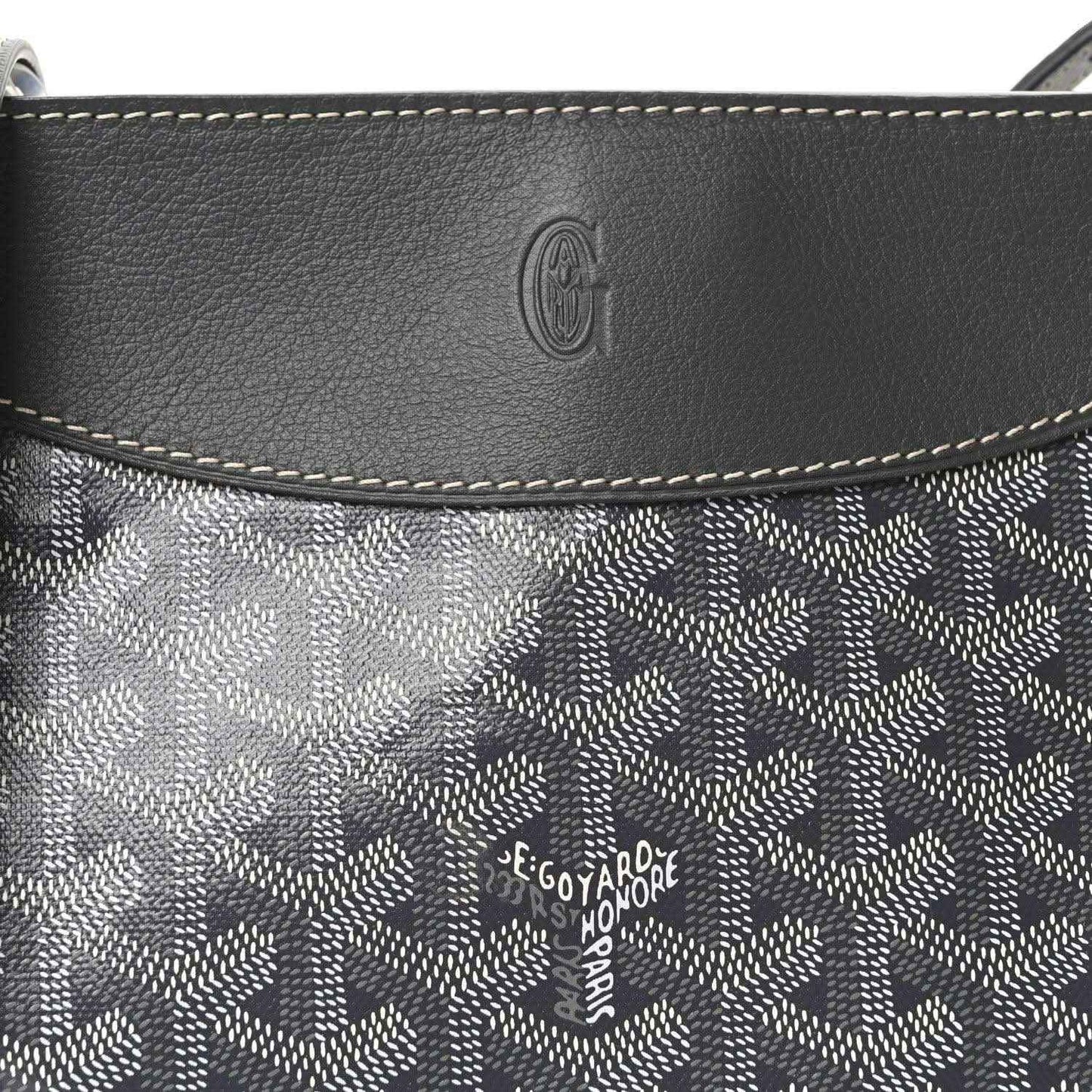 Grey leather-trimmed canvas flap with embossed Goyardine logo