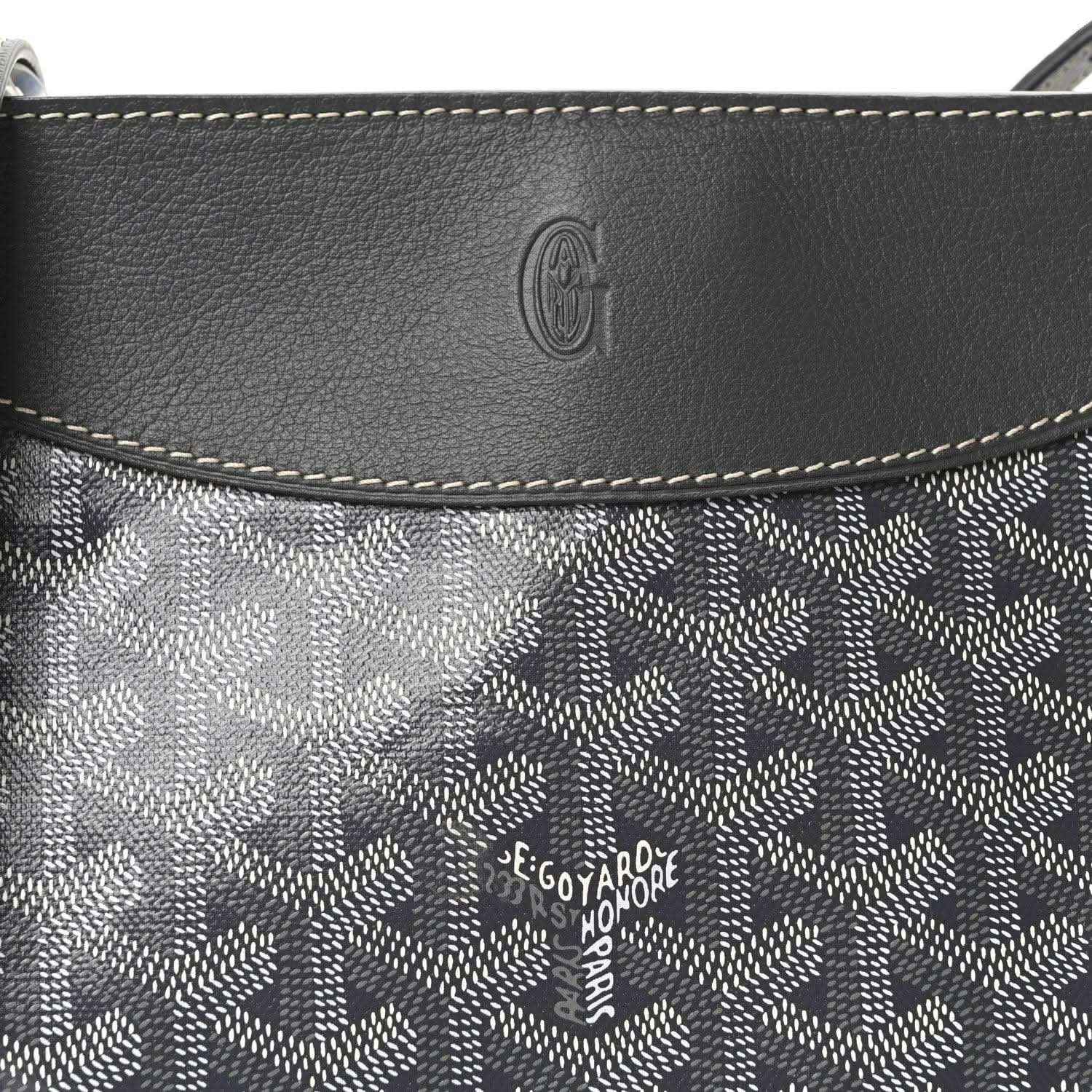 Grey leather-trimmed canvas flap with embossed Goyardine logo