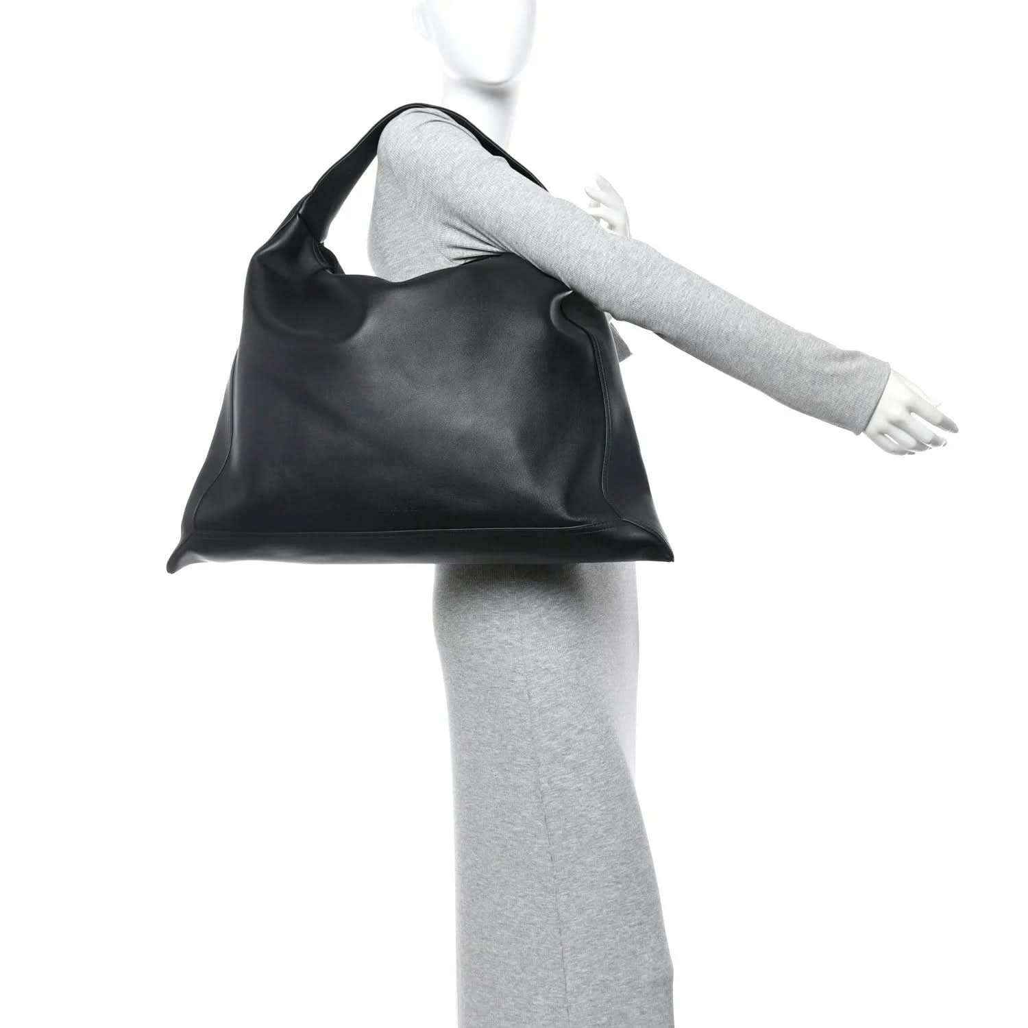 Bottega Veneta Large Hop bag, silky black calfskin, carried over shoulder on model