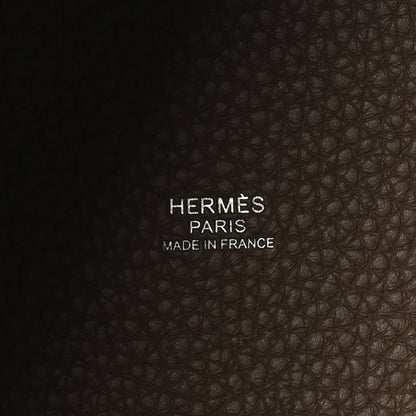 Pebbled leather base with stamped brand text