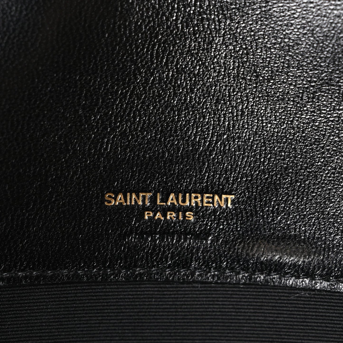 Black leather bag with Saint Laurent Paris embossed stamp