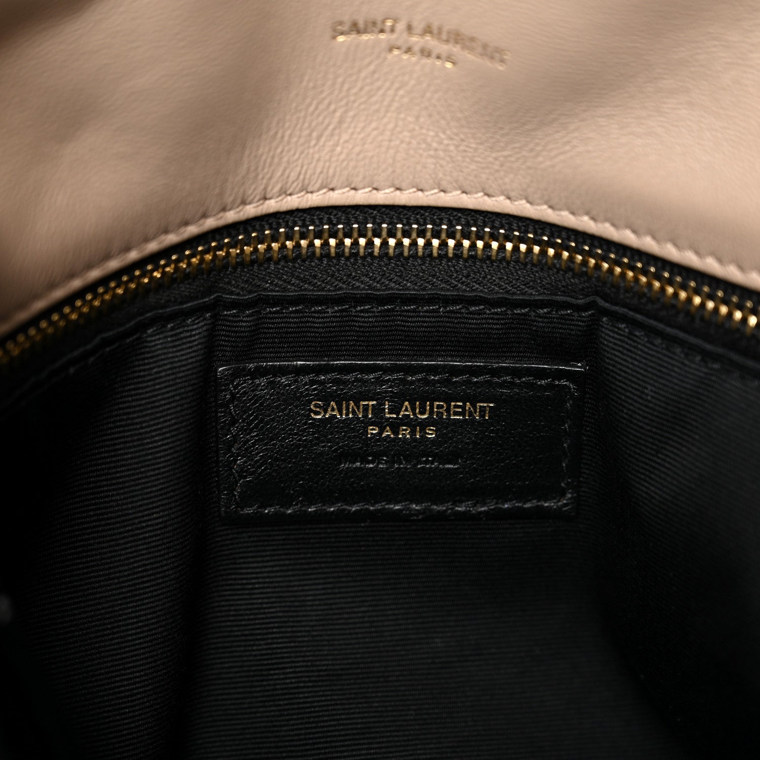 Black-lined interior pocket with gold zip and Saint Laurent Paris label