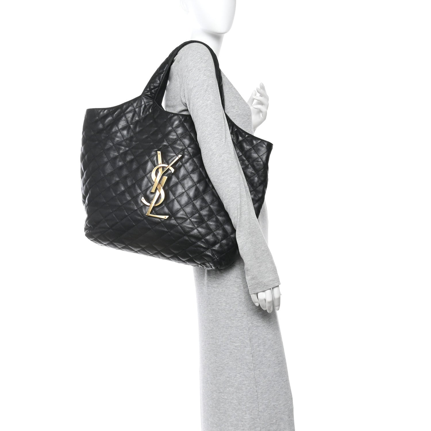 Black quilted leather tote, side view, with YSL logo and top handle
