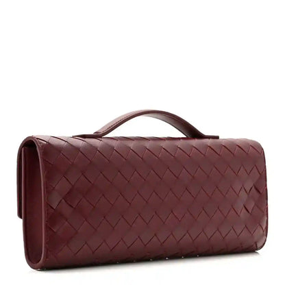 Burgundy Intrecciato clutch bag side view with top handle and woven texture