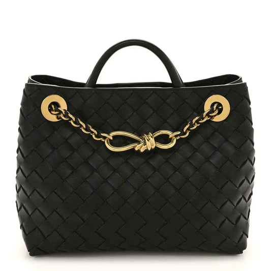 Black woven leather chain shoulder bag with top handle and gold-tone clasp hardware