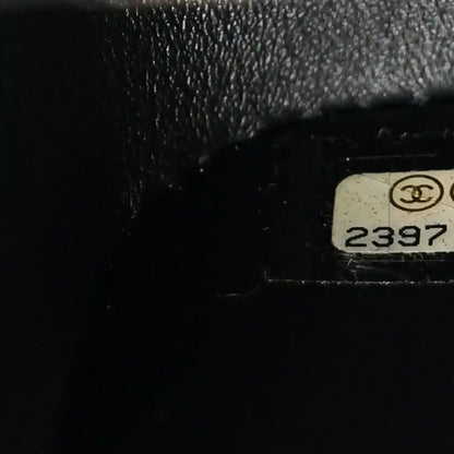 Black bag serial stamp with Chanel emblem and number 2397.