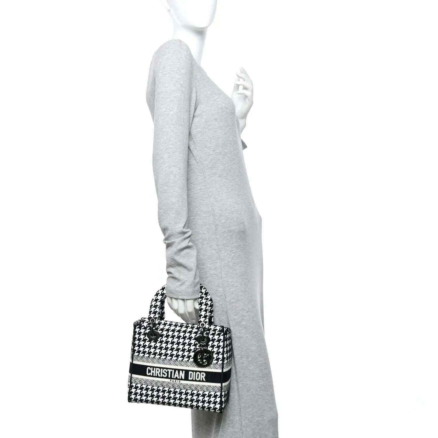 Black-and-white houndstooth canvas bag with short strap and Dior logo band