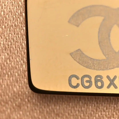 Chanel code stamp on beige fabric backing with raised lettering