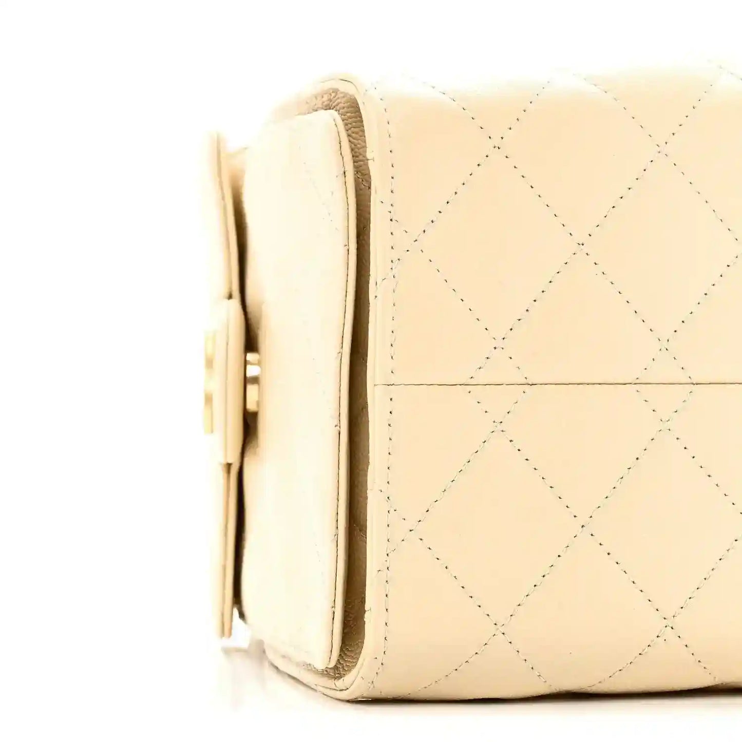 Light beige quilted handbag side view with flap pocket and chain strap