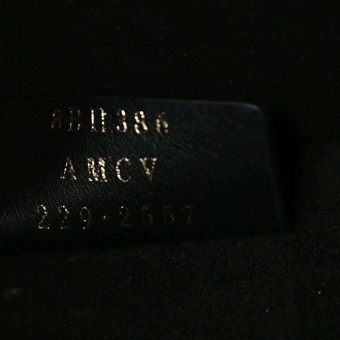 Black leather tote bag label with FENDI and Made in Italy text