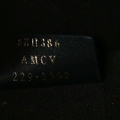 Black leather tote bag label with FENDI and Made in Italy text
