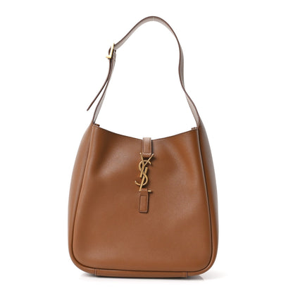 Tan soft hobo bag with gold YSL logo on center strap and top handles