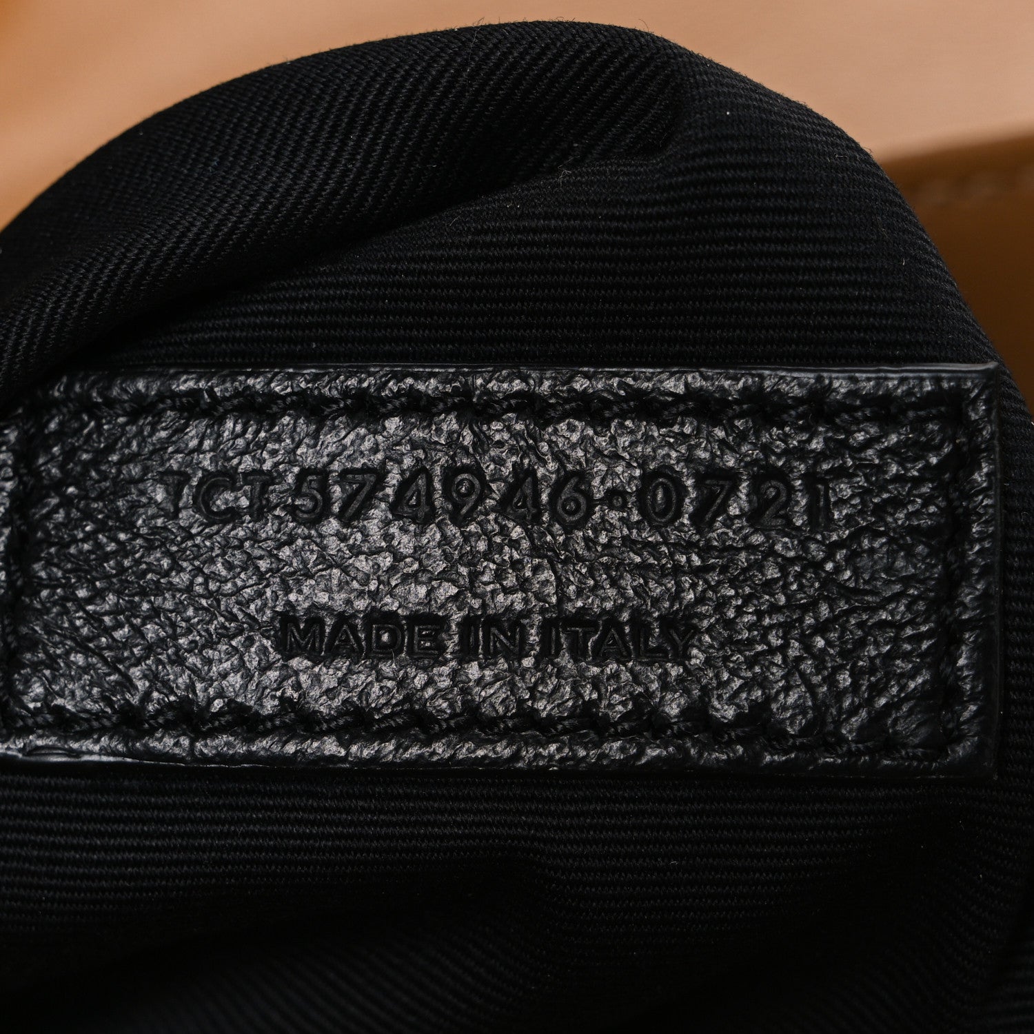 Black fabric interior stamp with code and “MADE IN ITALY” text