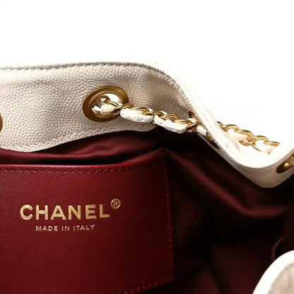 Mini handbag interior with Chanel label, dark burgundy lining, and gold-tone chain clasp