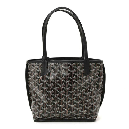 Reversible mini tote bag front view with black-and-gray patterned canvas and black leather trim