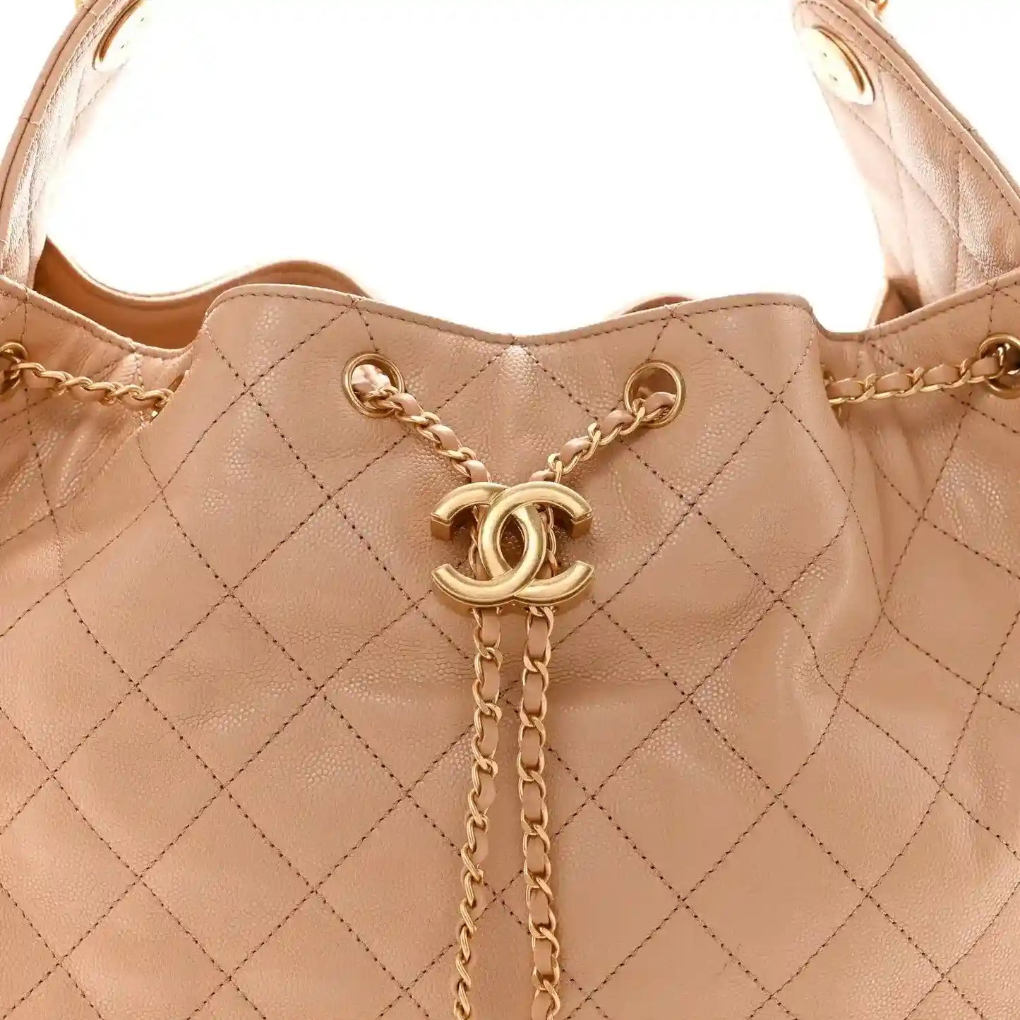 Beige quilted handbag with gold chain strap and CC logo charm at center