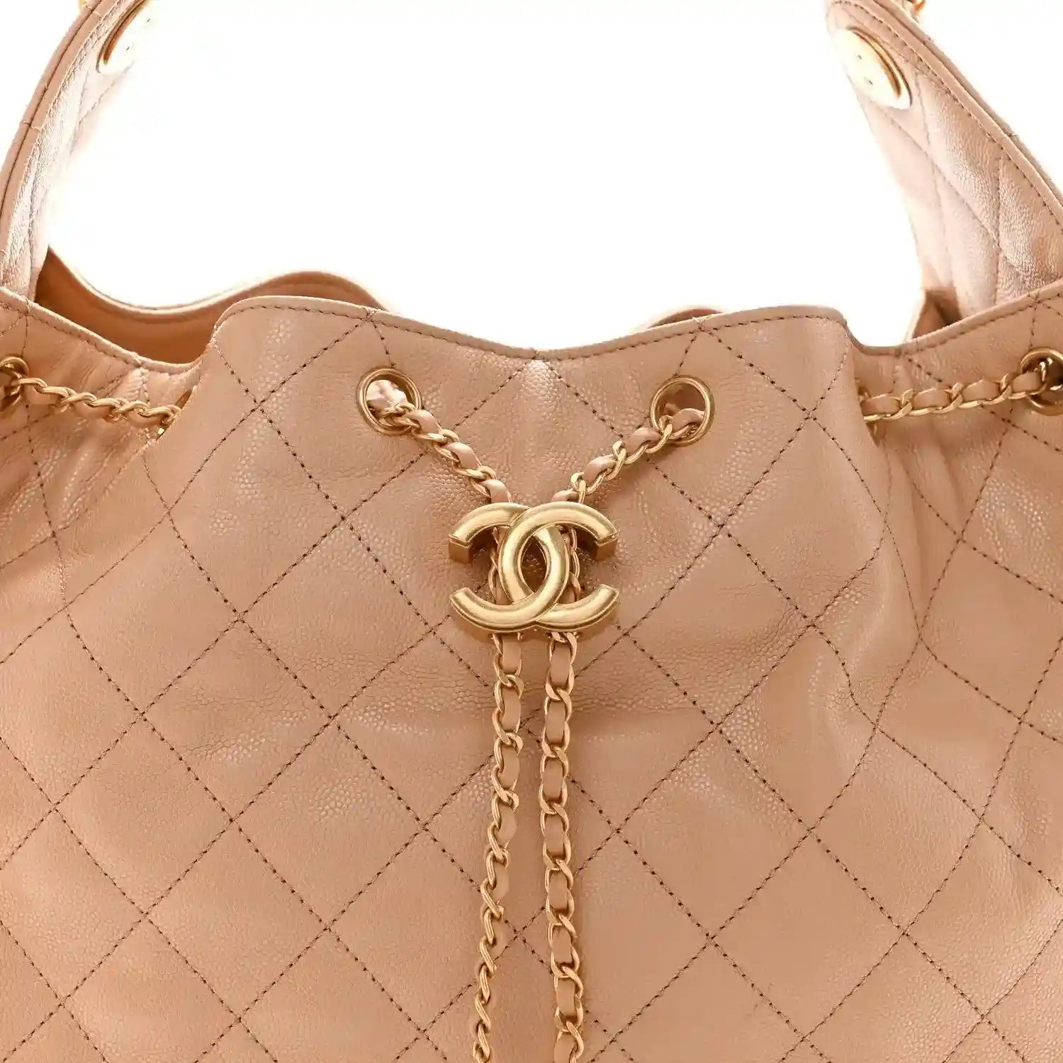 Beige quilted handbag with gold chain strap and CC logo charm at center