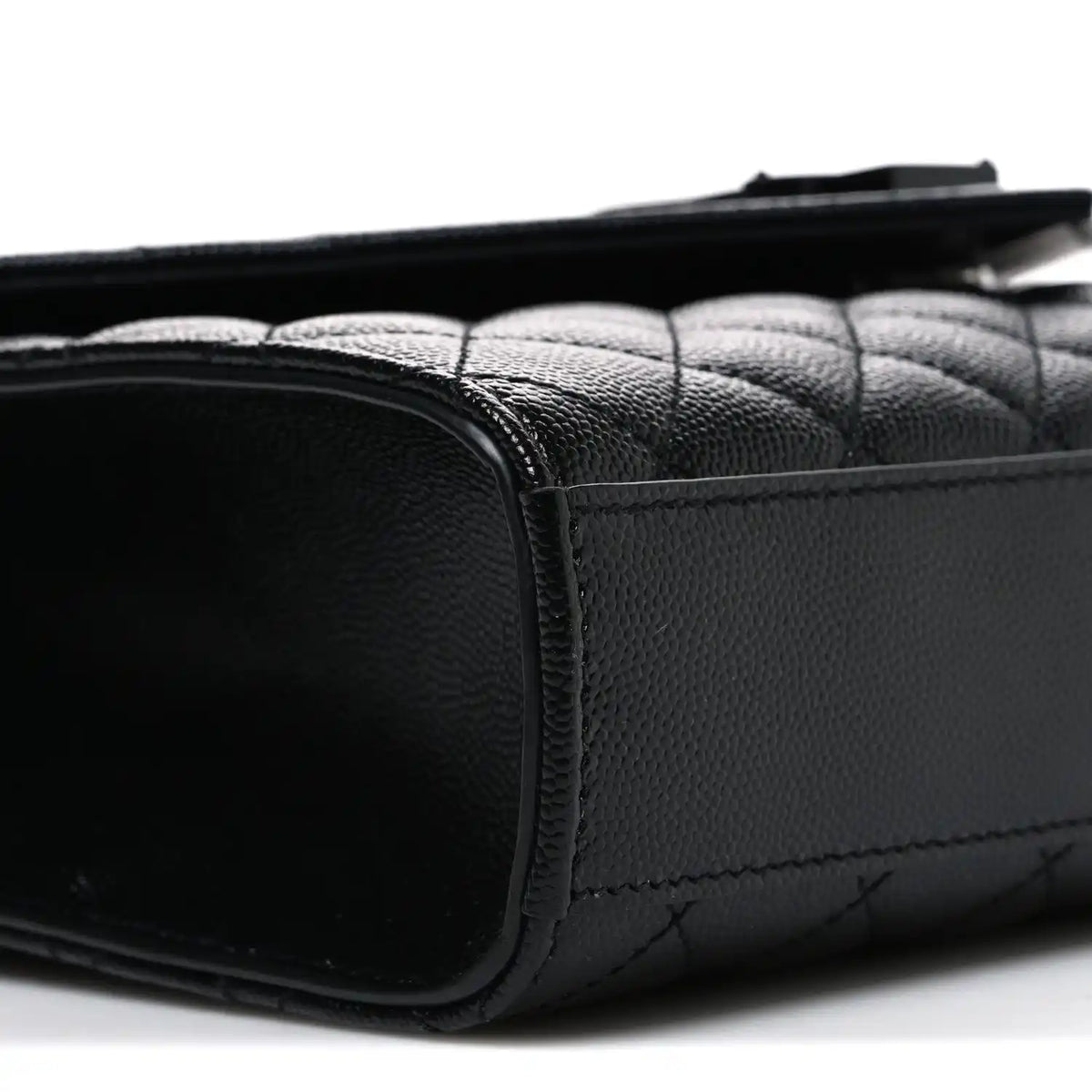 Saint Laurent black quilted satchel back corner with leather trim and stitched seam