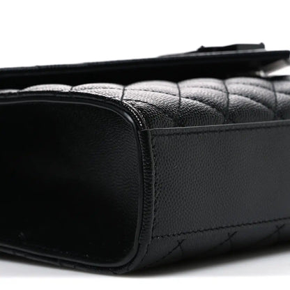 Saint Laurent black quilted satchel back corner with leather trim and stitched seam