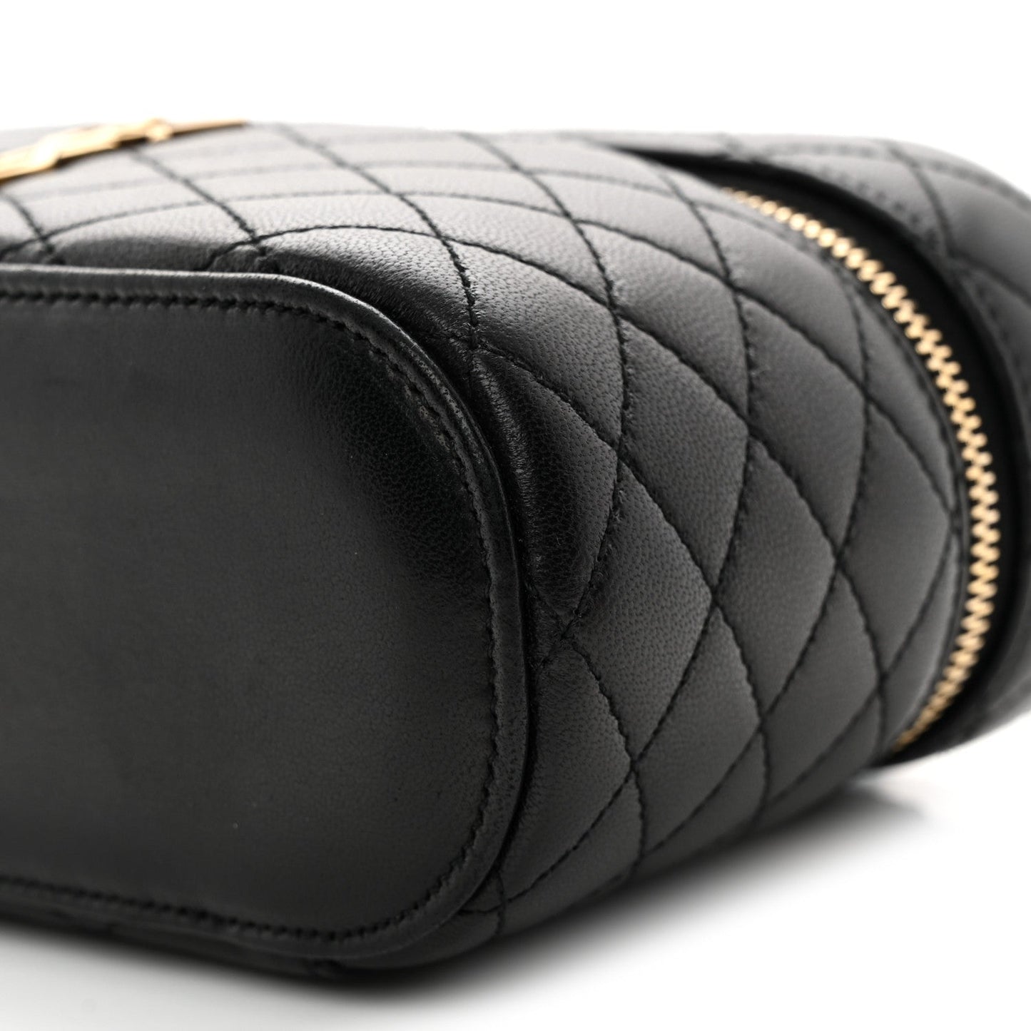 Saint Laurent mini quilted lambskin vanity case close-up of black quilting and rounded end
