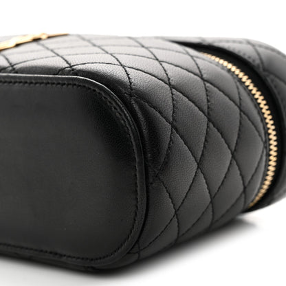 Saint Laurent mini quilted lambskin vanity case close-up of black quilting and rounded end