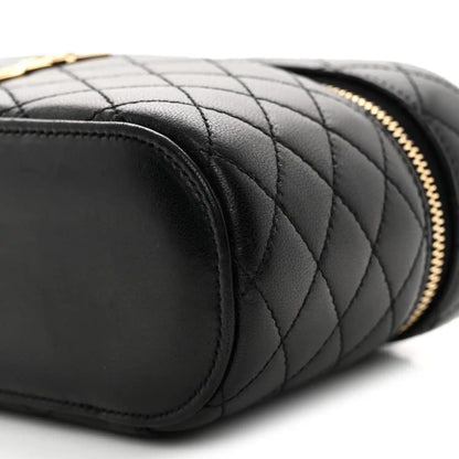 Saint Laurent mini quilted lambskin vanity case close-up of black quilting and rounded end
