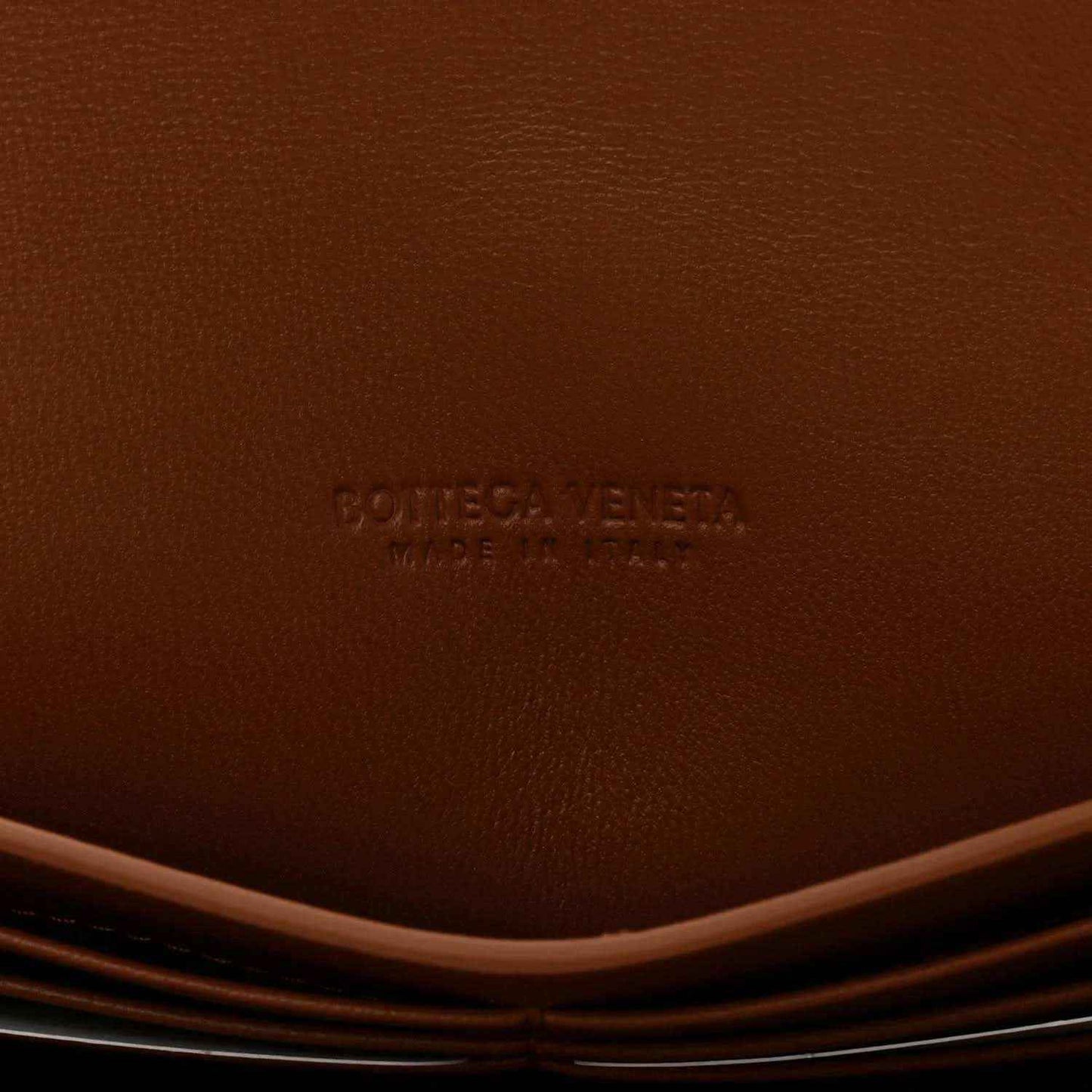Brown suede clutch interior with BOTTEGA VENETA embossed logo