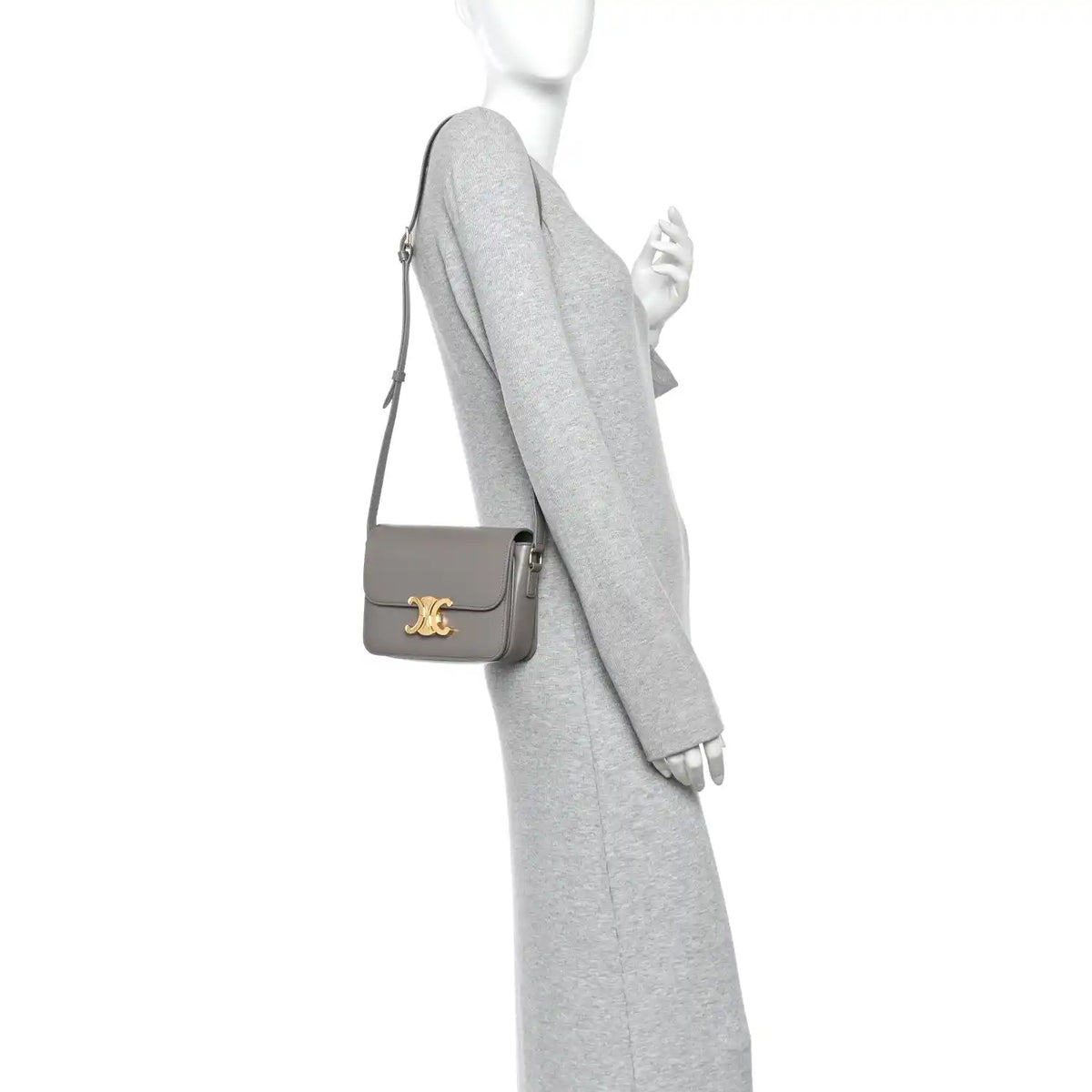 Celine shiny calfskin shoulder bag on model, light gray with gold-tone logo