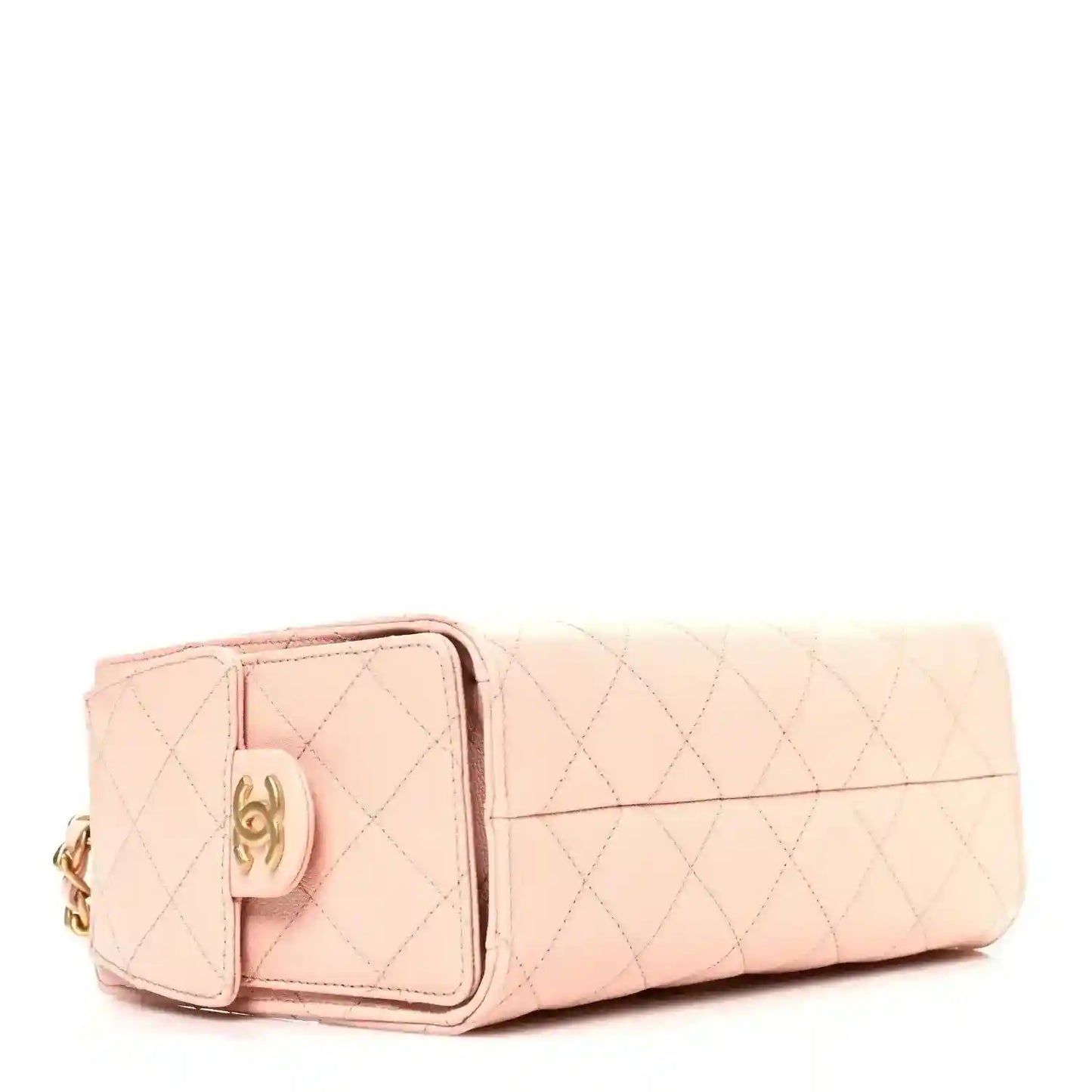 Light pink quilted mini handbag with front clasp and leather flap detail