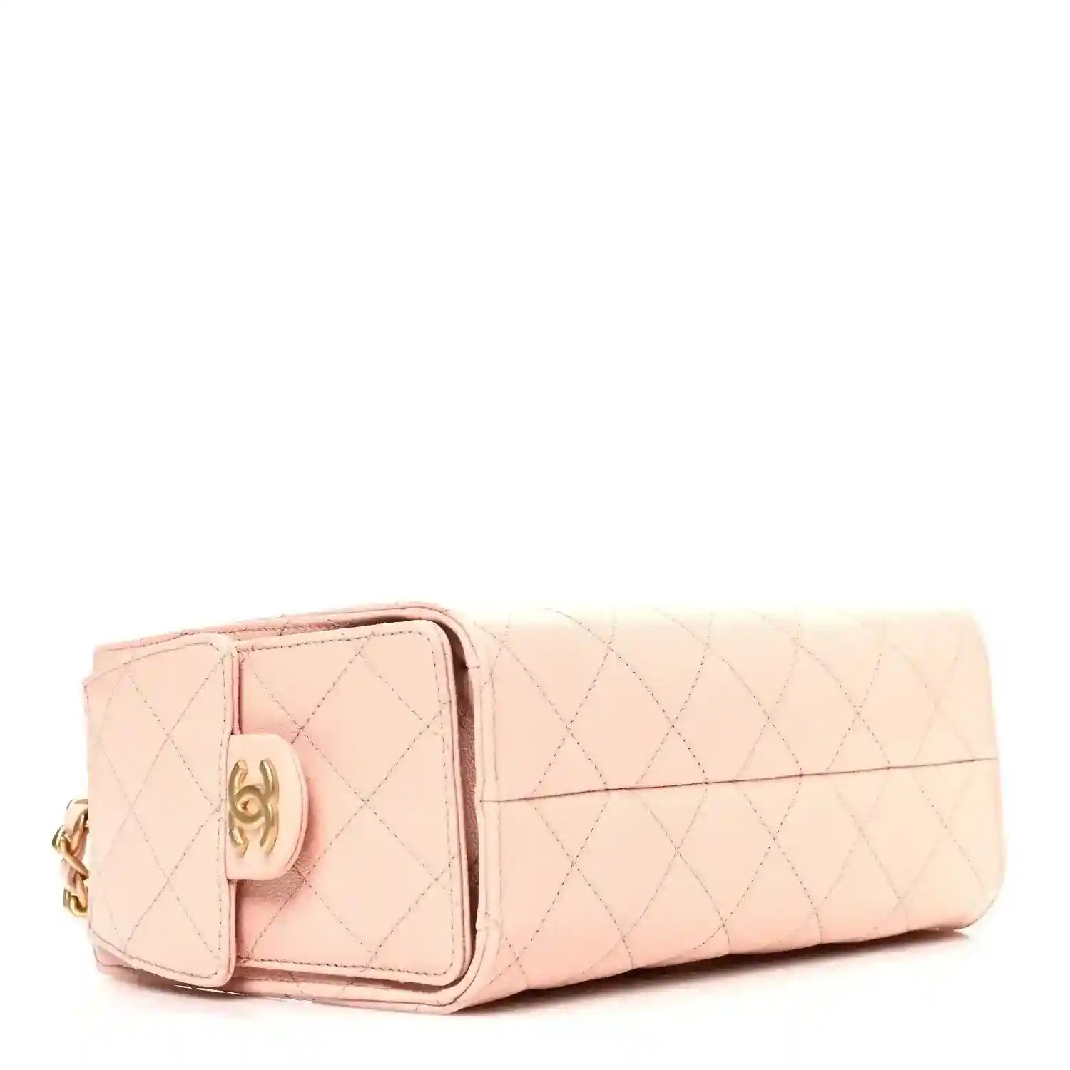 Light pink quilted mini handbag with front clasp and leather flap detail