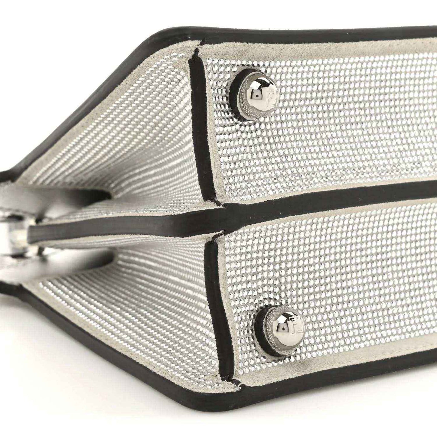 Petite Peekaboo satchel bag close-up of crystal front panels with metal logo emblems