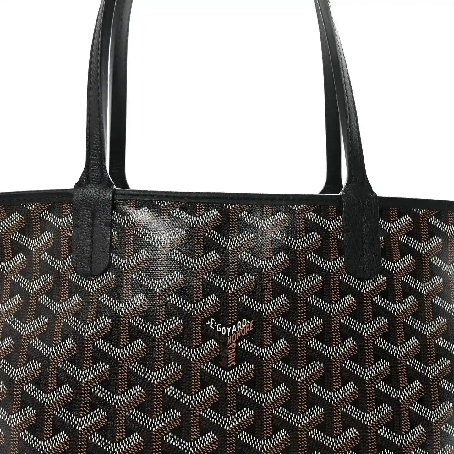 Goyardine tote bag front with black handles and small brand patch.