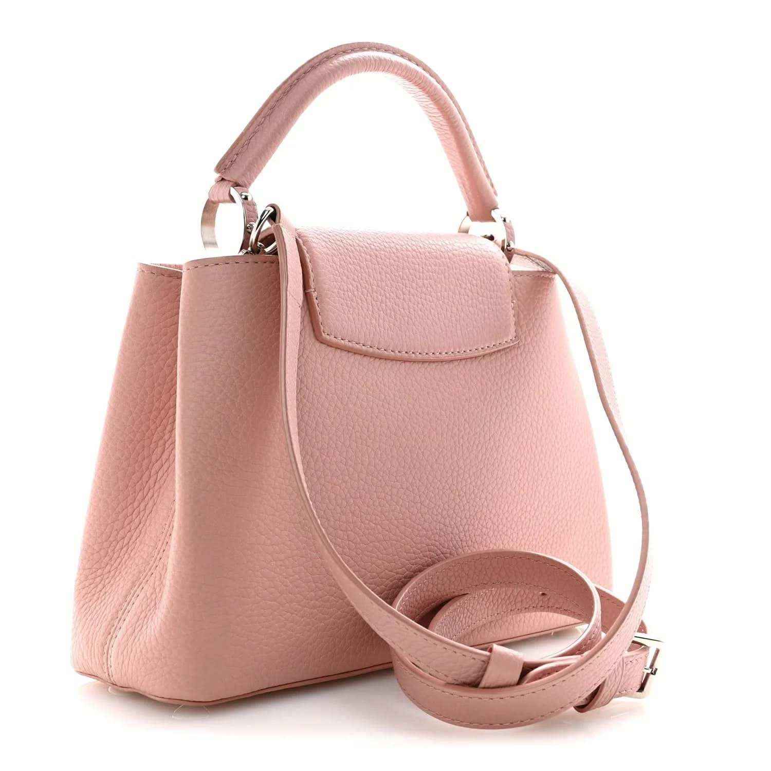 Pink leather handbag with top handle, crossbody strap, and curved front pocket