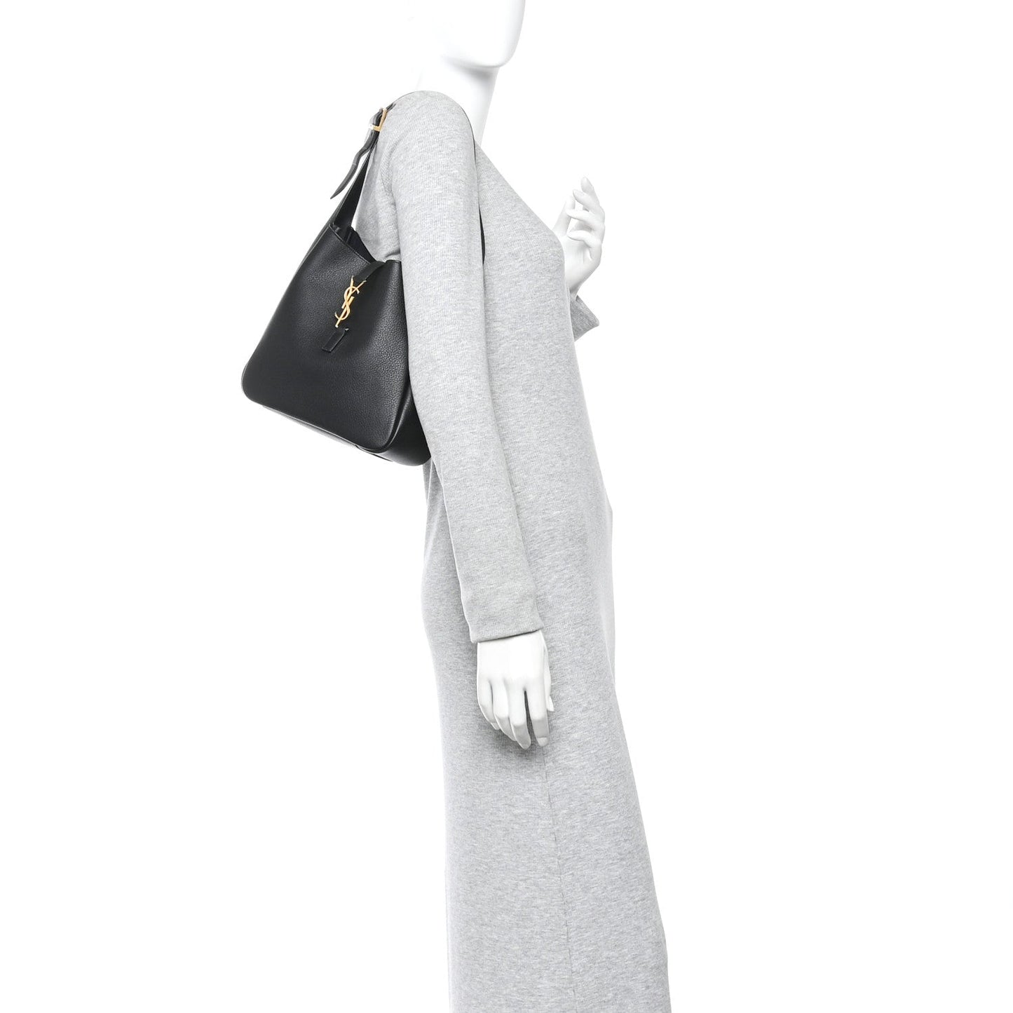 Black hobo handbag held at side, top handle and YSL logo on front panel.