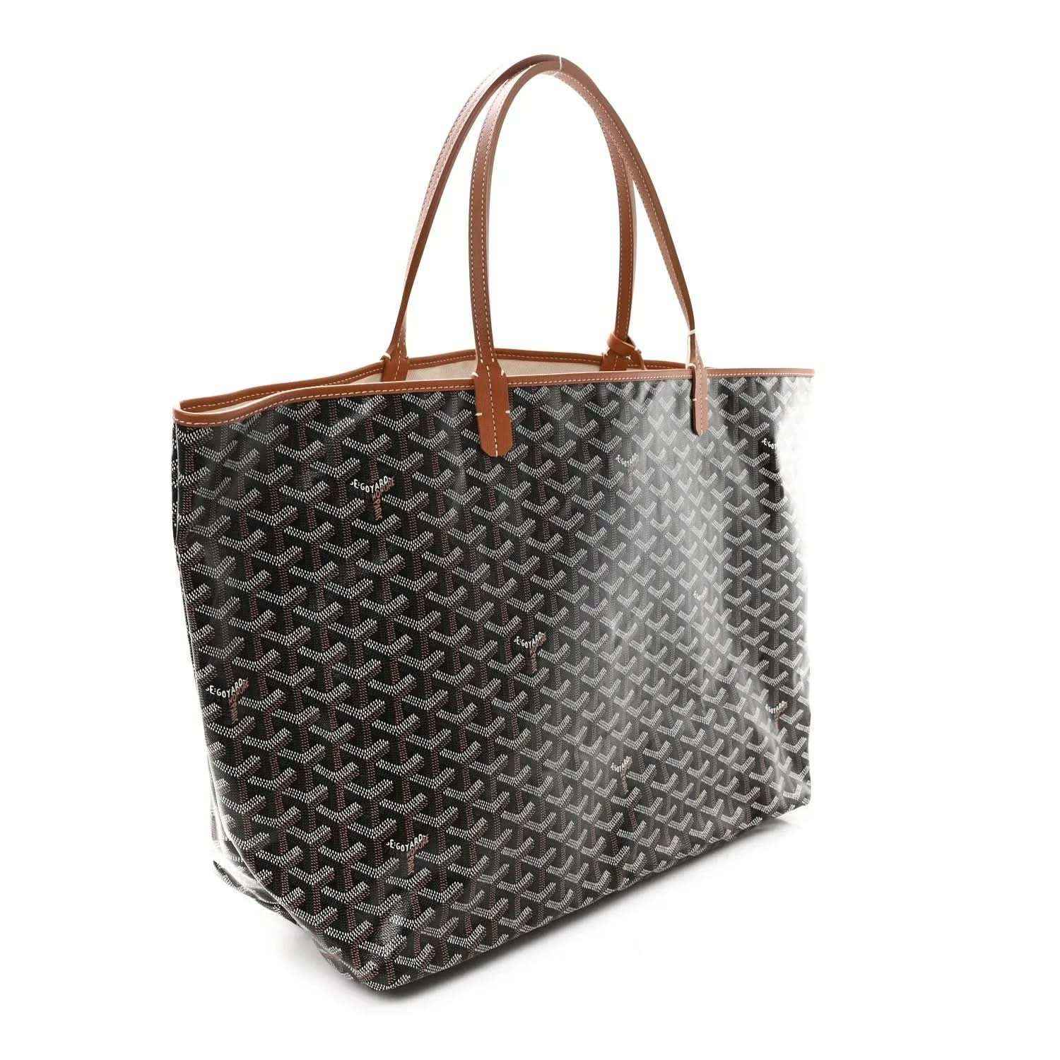 Black monogram tote bag with tan leather top handles and trim