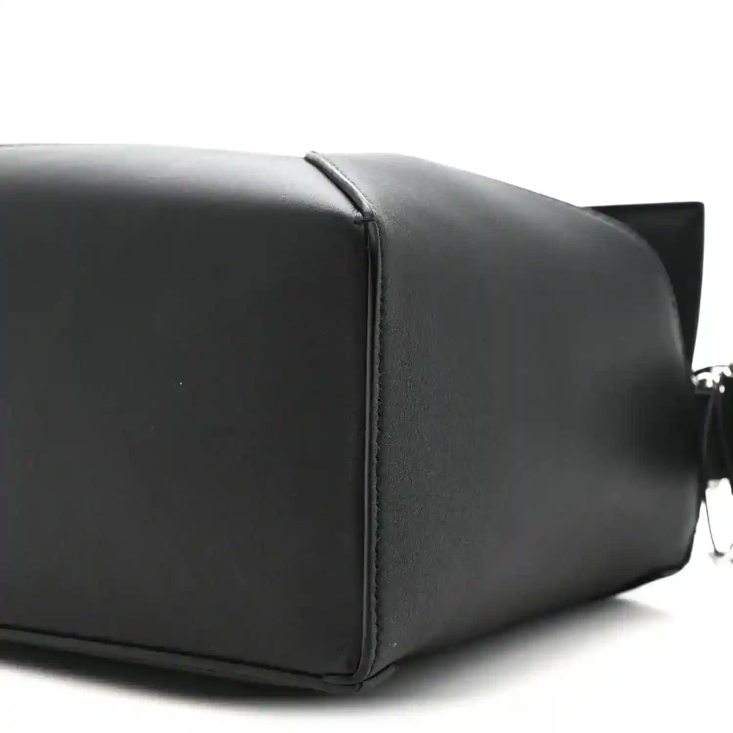 Small black calfskin shoulder bag with structured panels and top handle