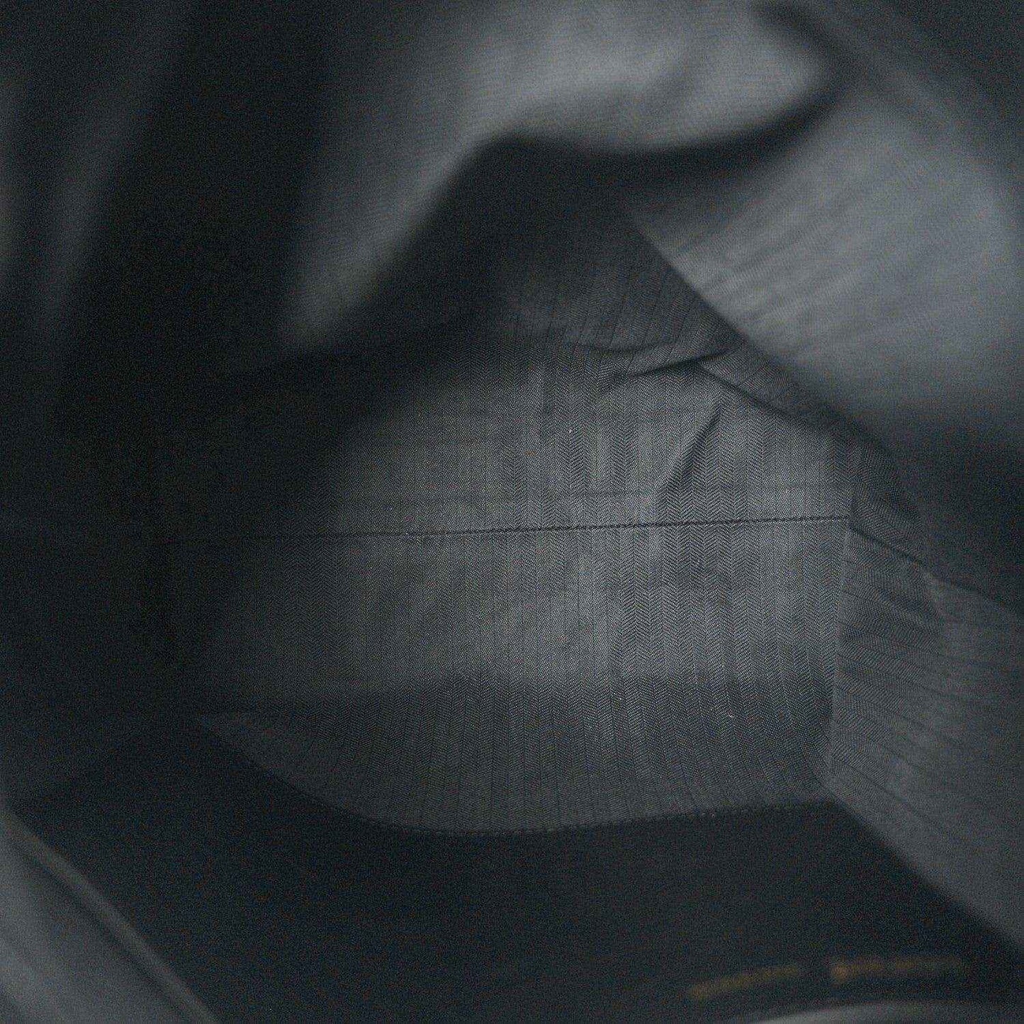 Black leather interior with subtle grain texture and smooth paneling