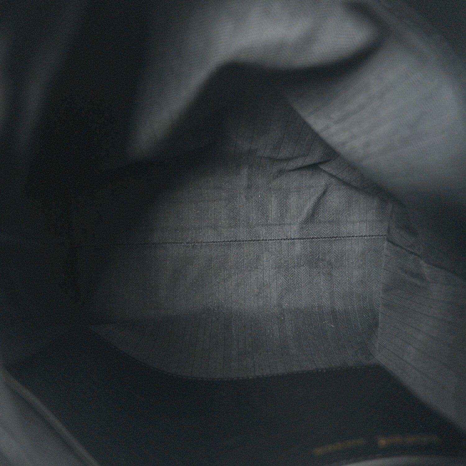 Black leather interior with subtle grain texture and smooth paneling