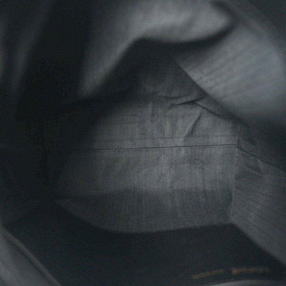 Black leather interior with subtle grain texture and smooth paneling