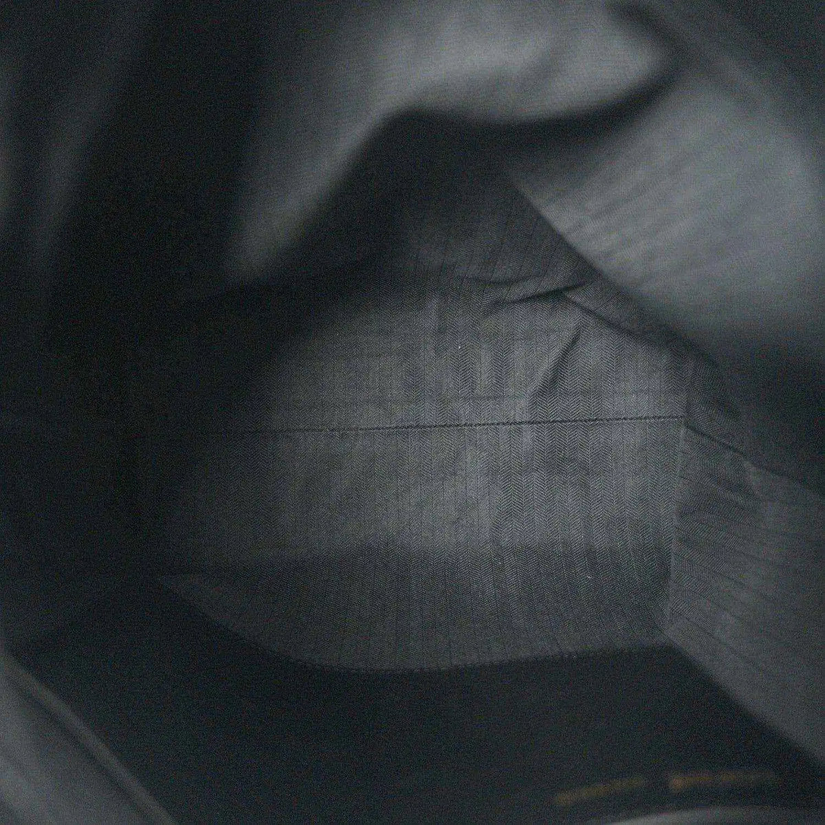 Black leather interior with subtle grain texture and smooth paneling