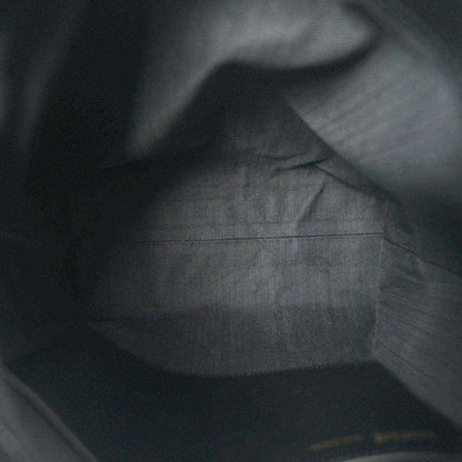 Black leather interior with subtle grain texture and smooth paneling