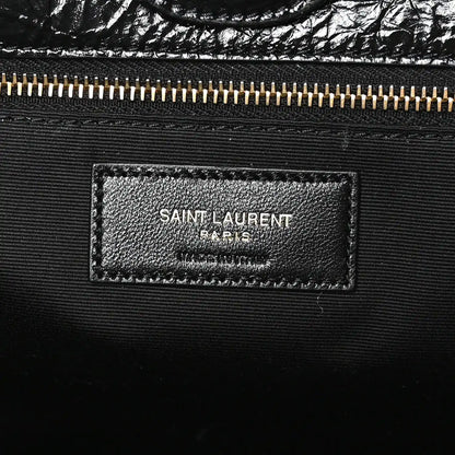 Black leather interior label with SAINT LAURENT PARIS text and gold zipper