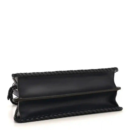 Nappa satchel with top flap, woven edge trim, and dark blue leather