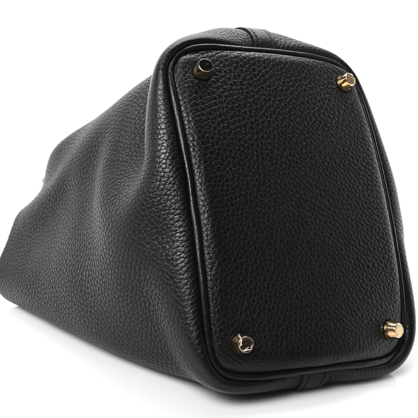 Black leather tote bag with top handle and gold-tone corner studs