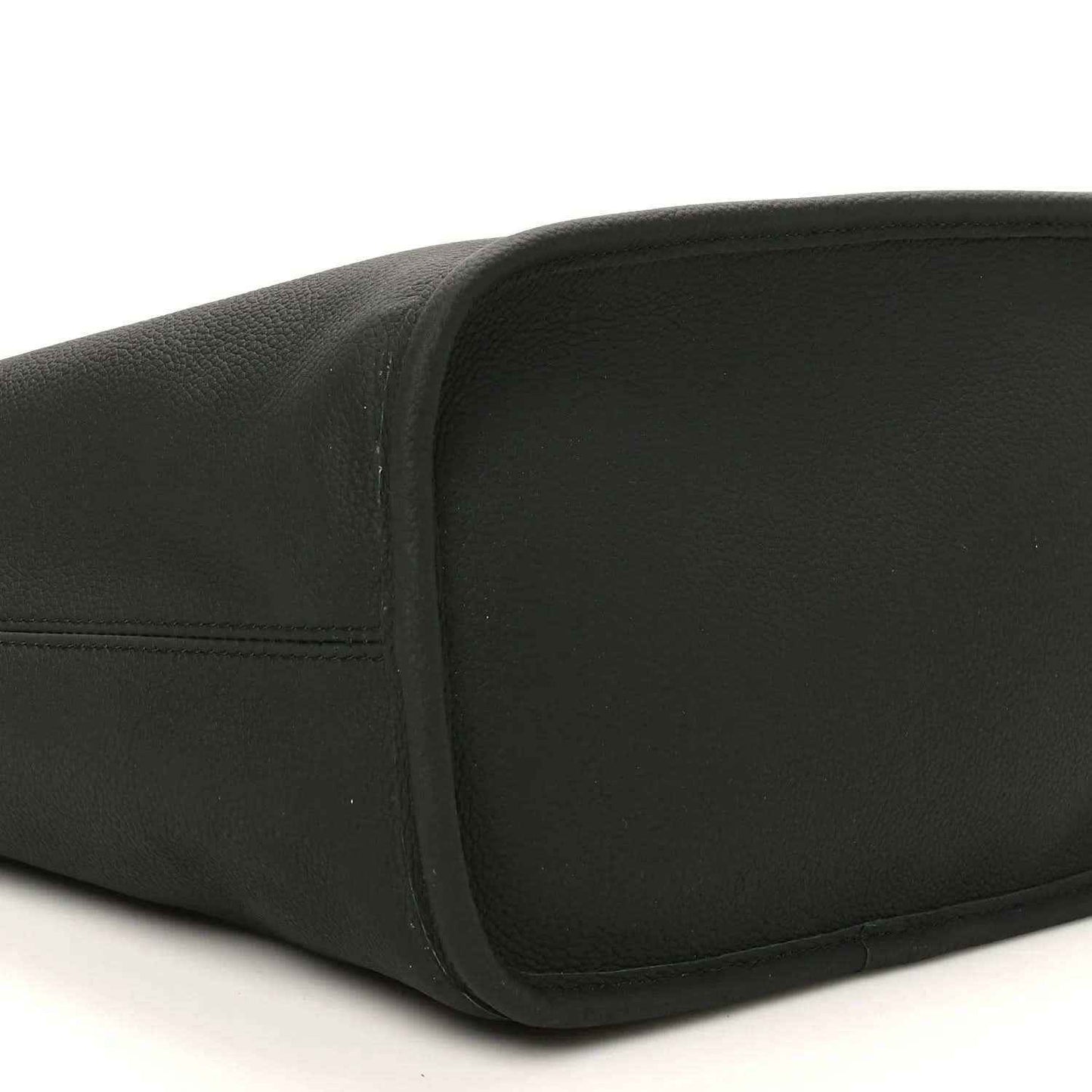 Black pebbled leather tote with rounded bottom edge and visible stitching