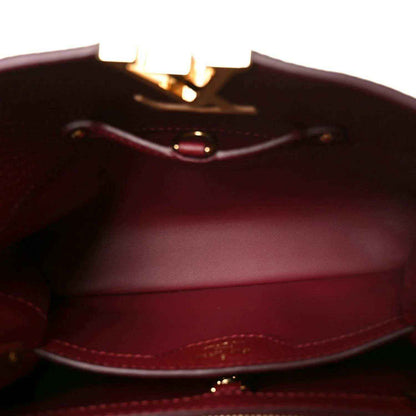Burgundy leather interior with stitching and small clasp hardware visible.