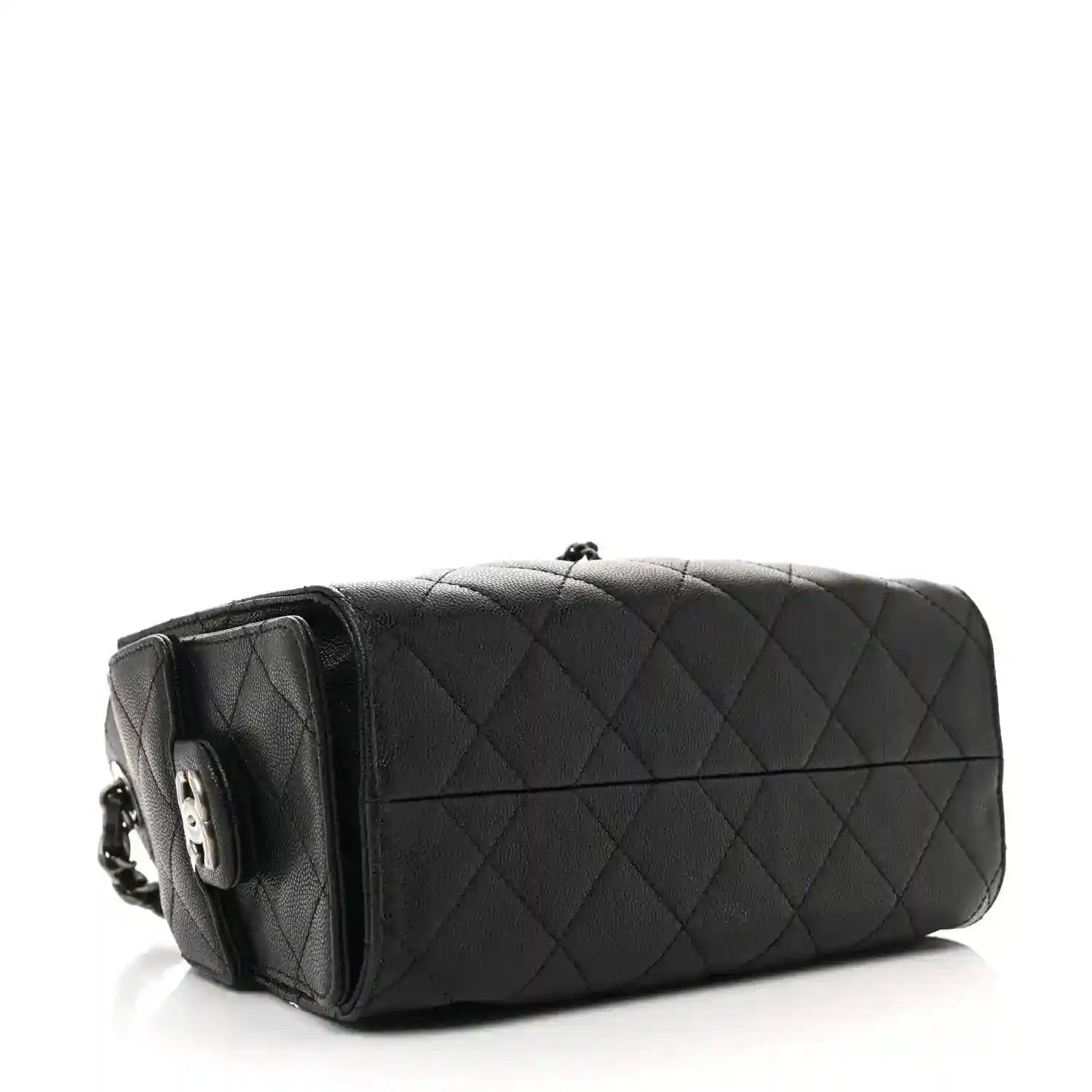 Black quilted mini shoulder bag with chain strap and structured top, side view.