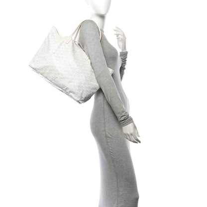 Goyard Saint Louis PM tote bag, white canvas, side view held by the handles
